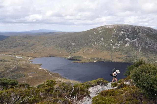 Gill nearing the top with Dove Lake looking spectacular in the background