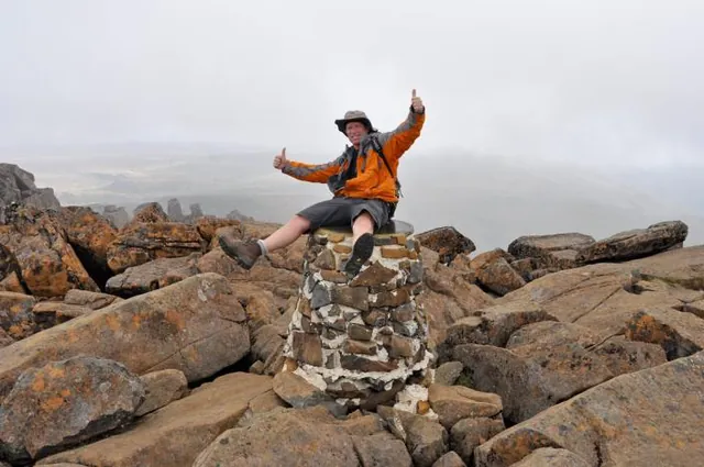 Darrell having a rest on the summit monument