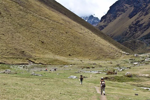 We reach our camp site at the foot of these huge mountains