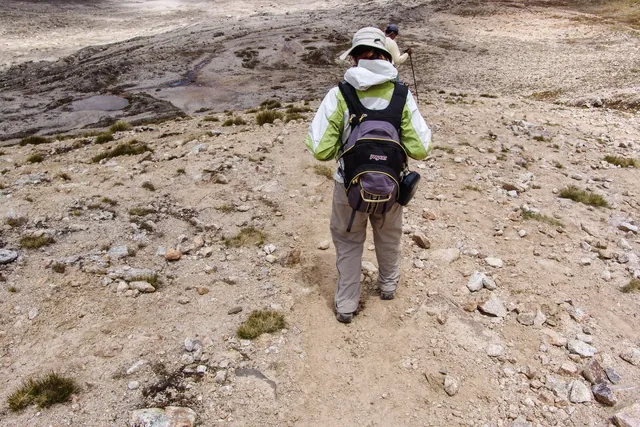 Before we descend into the next valley, we lay down an offering to the Gods of rocks, wine and coca leaves