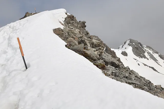 The summit comes into view... just another precarious ridge to cross