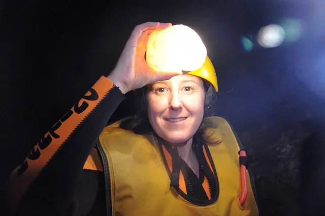 Head-torch shining through the a translucent calcite rock (tip of the hat to Howie for the idea)