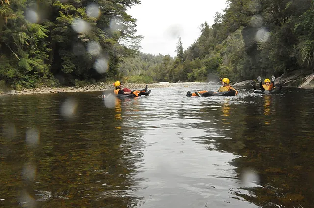 We float out to the calm river end to exit