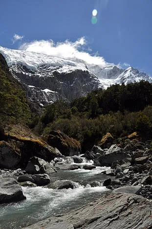 Finally, the glacier shows itself after a few fleeting glimpses through the trees on the way up