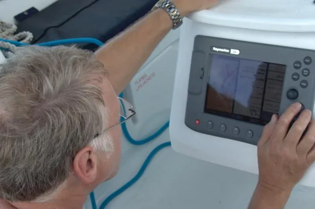 Mike checking our sailing route to Hayman Island on the cockpit GPS