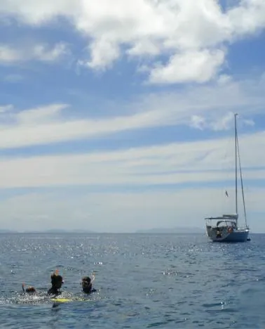 Maggie, Gill and Mike snorkeling straight off the boat at Hayman Island