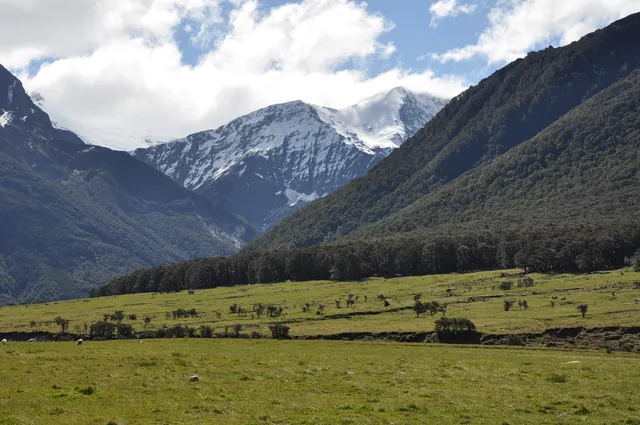Further down the valley, huge snow-capped peaks unfold