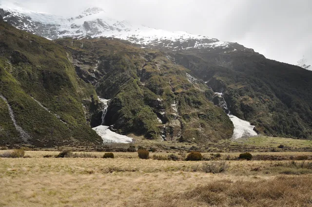 Two snow piles at the bottom of waterfalls. We decided to get closer and investigate