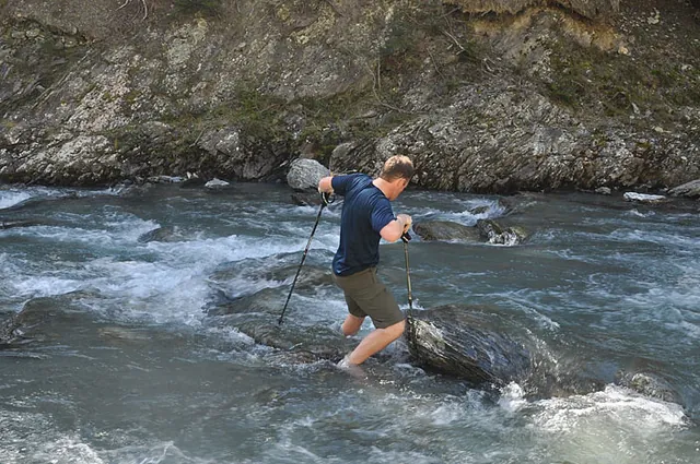 This is the biggest river we've ever had to cross with backpacks on. I decide to do a test run