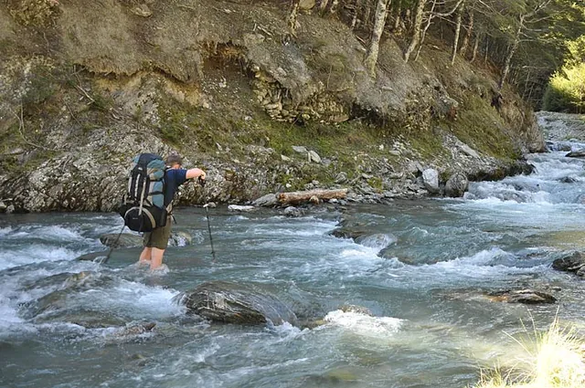 The river was fast flowing so I gingerly went across with both packs